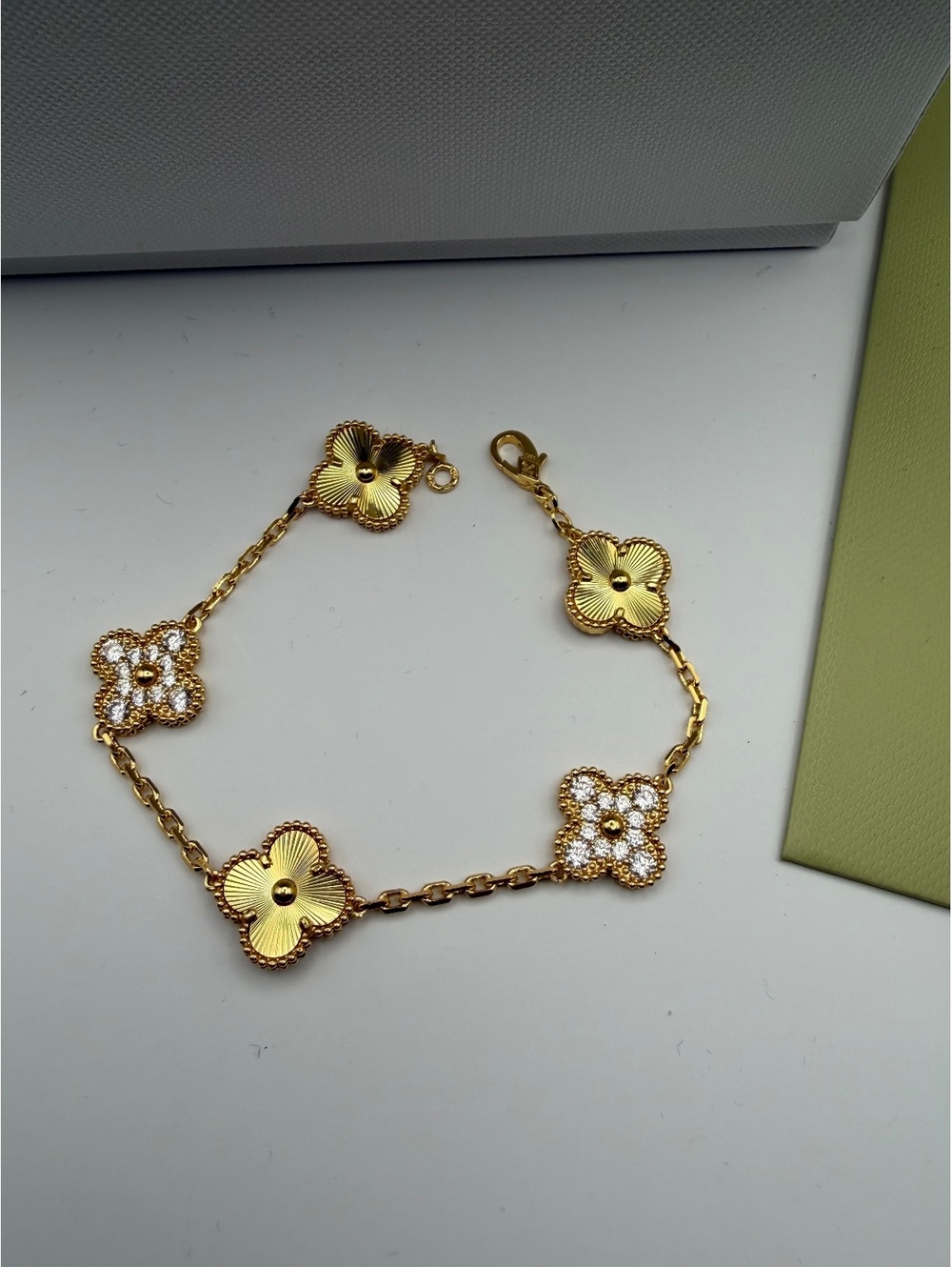 Elegant Gold Tone Clover Link Bracelet with Crystal Accents